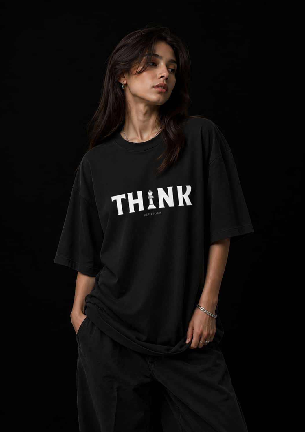 Zeroform Person wearing a black t-shirt with 'THINK' printed on it against a black background
