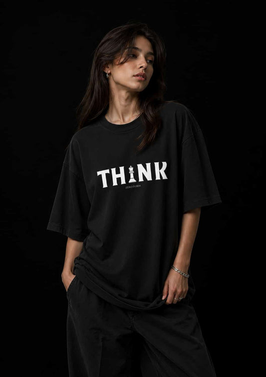Zeroform Person wearing a black t-shirt with 'THINK' printed on it against a black background