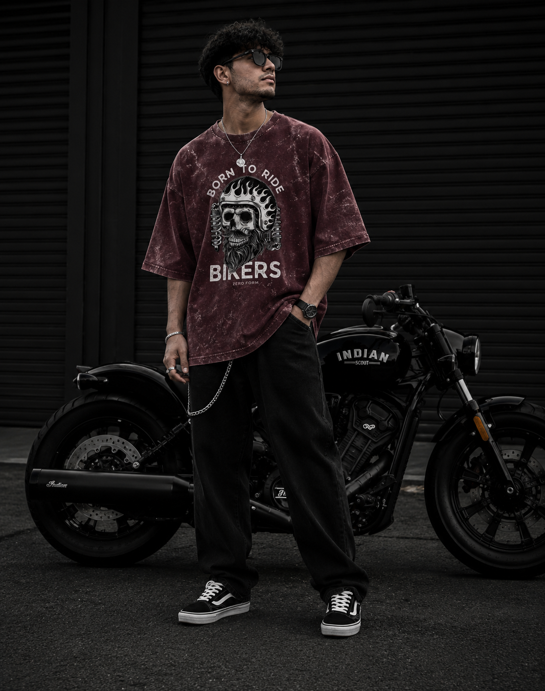 Zerofrom Born to Ride Oversized | 100% Cotton Acid Wash Person wearing a maroon t-shirt with a graphic design standing next to a motorcycle.